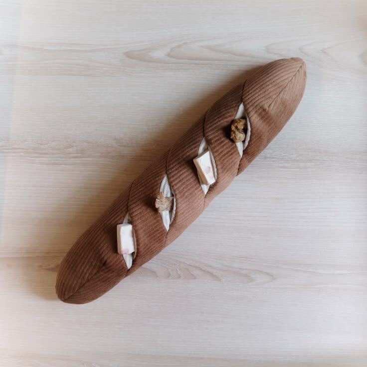 Baguette Enrichment Dog Toy - close-up of enrichment pockets with hidden treats