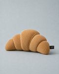 Corduroy Croissant Plush Dog Toy — tan ribbed corduroy plush shaped like a croissant, with woven Mayberry Mutts tag