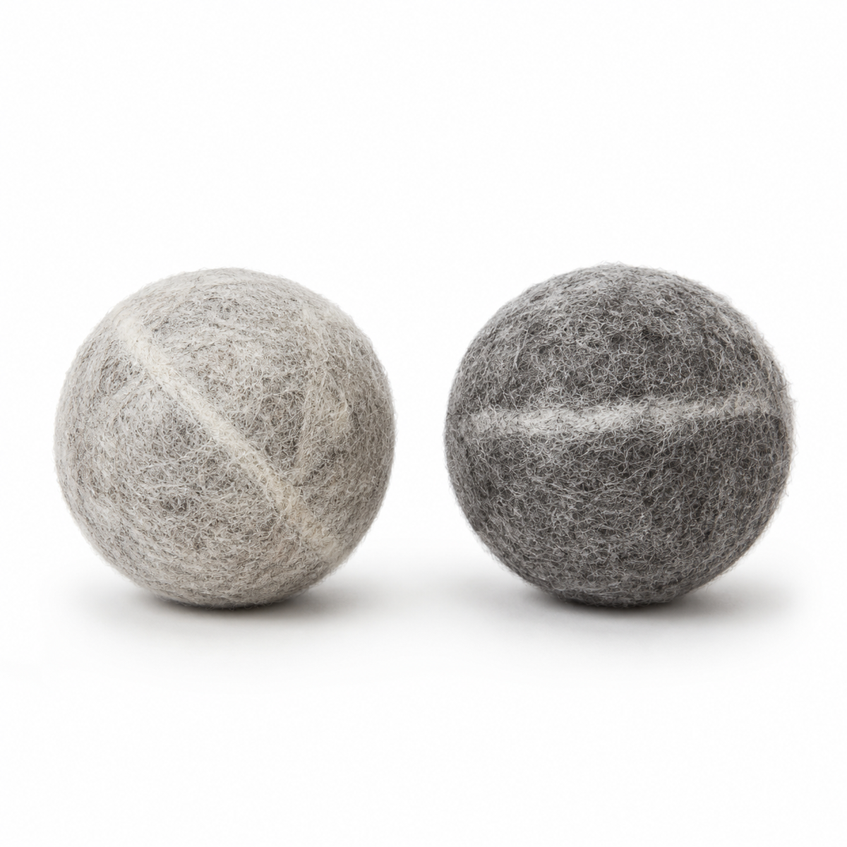The Mayberry Wool Fetch Ball - light grey and charcoal balls side by side